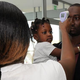 A doctor at the National Public Health Institute takes the temperature of a man at the airport in Ivory Coast Aug. 13, 2014, as part of protective measures against the Ebola virus.
SIA KAMBOU/Getty Images